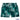 Green swim shorts with tropical leaf pattern on a white background, featuring 'Island Style Clothing' brand.