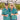 Two people wearing matching teal shirts with a beach theme, standing under an outdoor canopy.