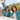 People wearing matching teal shirts with a logo, sitting outdoors.