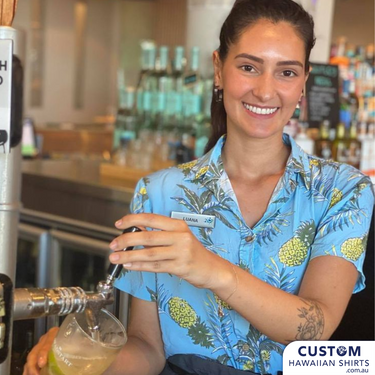 Woman wearing Blue Hawaiian shirt pouring beer