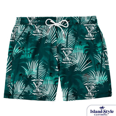 Green swim shorts with tropical leaf pattern on a white background, featuring 'Island Style Clothing' brand.