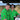 Two men in matching green shirts with festive patterns standing under a tent.