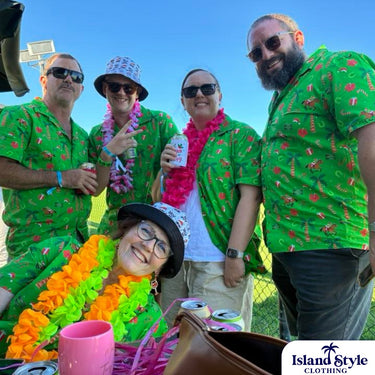 Group of people wearing matching green shirts with floral patterns, posing outdoors.