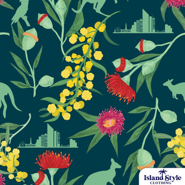 Patterned fabric with flowers, leaves, and city skyline on a dark blue background.