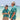 Two people in matching teal Hawaiian shirts on a beach with clear blue water and sky.