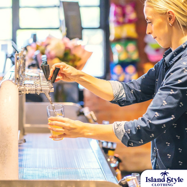 Bar and Hotel staff shirts custom-designed hospitality uniforms for Palm &amp; Pawn Hotel.