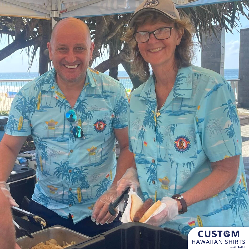 Surfers Paradise Surf Life Saving Club in Queensland wanted some new custom shirts for the Supporters Club. This is a stylish design featuring palms, Tower 34, flag and a surf board on a blue base.  Open collar Top pocket with logo Embossed Coconut buttons (one spare) Aussie Designed Shirts