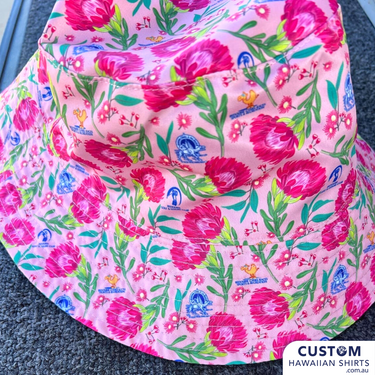 Bedourie Golf & Leisure Club geared up with some wicked personalised merch for their annual 'Camel and Pig Races' out west QLD.  We designed and made for them reversible Custom Bucket Hats to match Hawaiian Shirts. Ridgey Didge best event festival merch. Designed with Australian botanicals.
