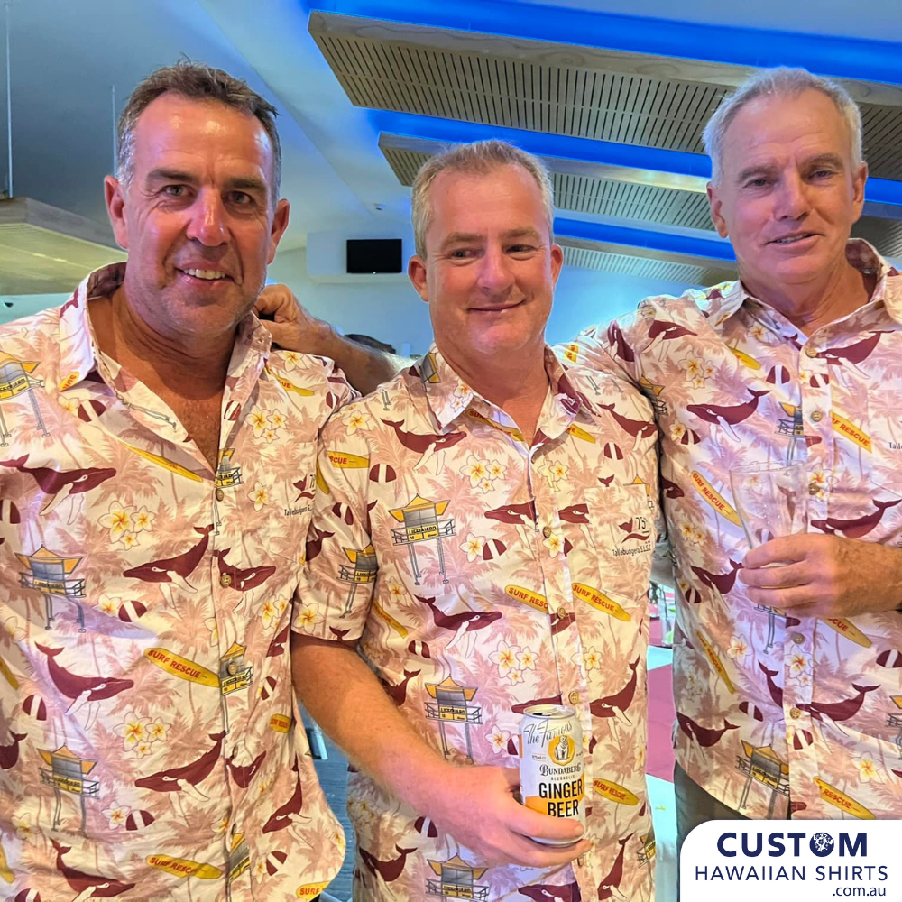 These cool custom face shirts were designed for the Tallebudgera Surf Life Saving Club. They feature whales, life saving tower, surf board with a background of frangipanis and palms.  'BETWEEN THE FLAGS'  There is always something happening at the Tallebudgera Surf Club. They welcome visitors and members to enjoy a first-class meal at their oceanfront restaurant, have a cold drink at the air-conditioned bar, and use their extensive gaming facilities.